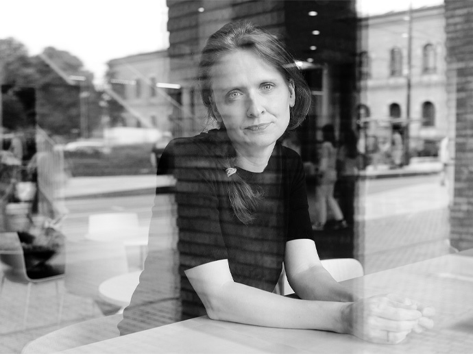 Mareile Kaufmann sits behind a cafe window