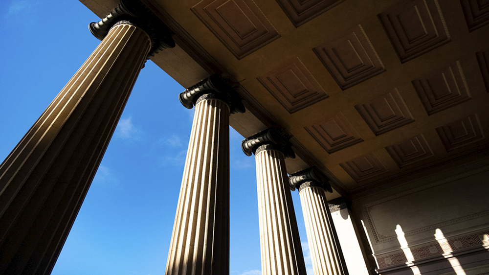 Illustration photo of columns reaching towards the sky. 