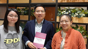 From left:&amp;#160;Yijun Liu, Professor Ding Peng, two of the book&#39;s editors, and Peng Yujiao, who is one of the contributing authors of the book.